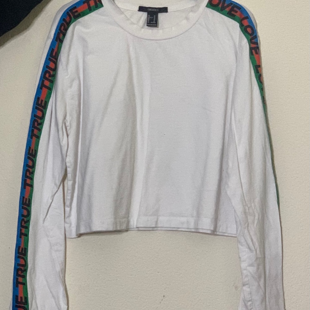 White sweatshirt with words on the sleeve